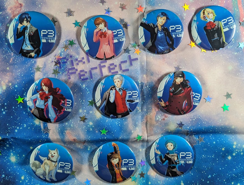 May include: Nine round blue and white buttons featuring different characters from the video game Persona 3. Each button displays the text "P3" and "PERSONA 3" in white. The buttons showcase various characters from the game, including a dog, a girl with red hair, a boy with blue hair, and a girl with blonde hair.