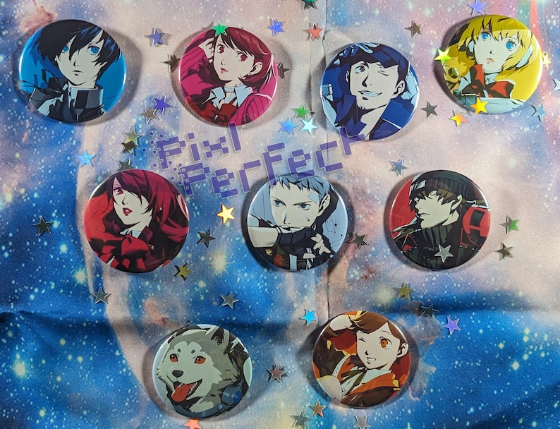 May include: Nine round buttons featuring various anime characters. The buttons are colourful and have a glossy finish. They are arranged in a circle on a blue and white background.