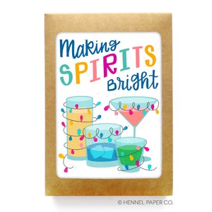 May include: A greeting card with a white background and colorful text that reads "Making Spirits Bright". The card features a cartoon illustration of four glasses with colorful lights wrapped around them.