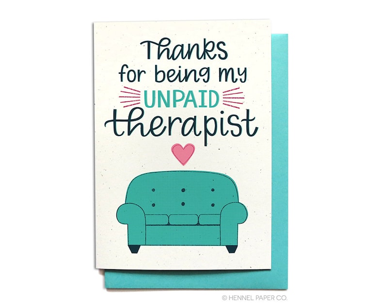 May include: A card with a light brown background and a teal couch with a pink heart above it. The text on the card reads "Thanks for being my UNPAID therapist".
