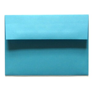 May include: A light blue envelope with a flap.