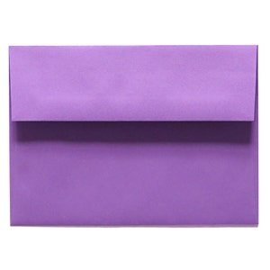 May include: A purple envelope, a standard size for letters and cards.