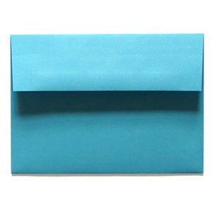 May include: A light blue envelope, ready to be addressed and sent.