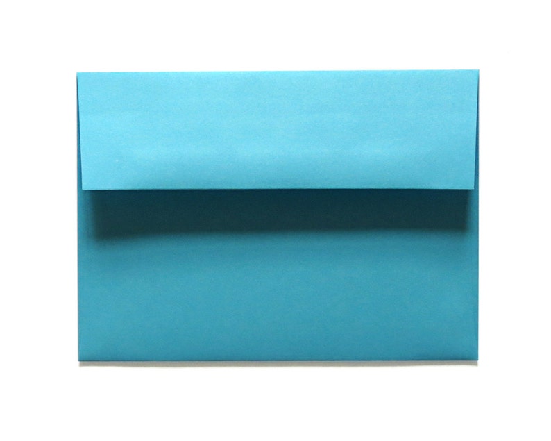 May include: A light blue envelope, ready to be addressed and sent.