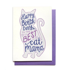 May include: A purple and blue greeting card with a silhouette of a cat. The card says "Happy Birthday to the Best Cat Mama".
