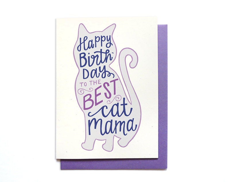 May include: A purple and blue greeting card with a silhouette of a cat. The card says "Happy Birthday to the Best Cat Mama".