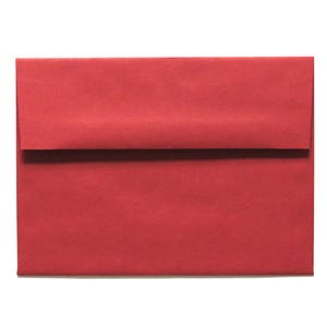 May include: A red envelope with a flap on the top. The envelope is made of a textured paper.