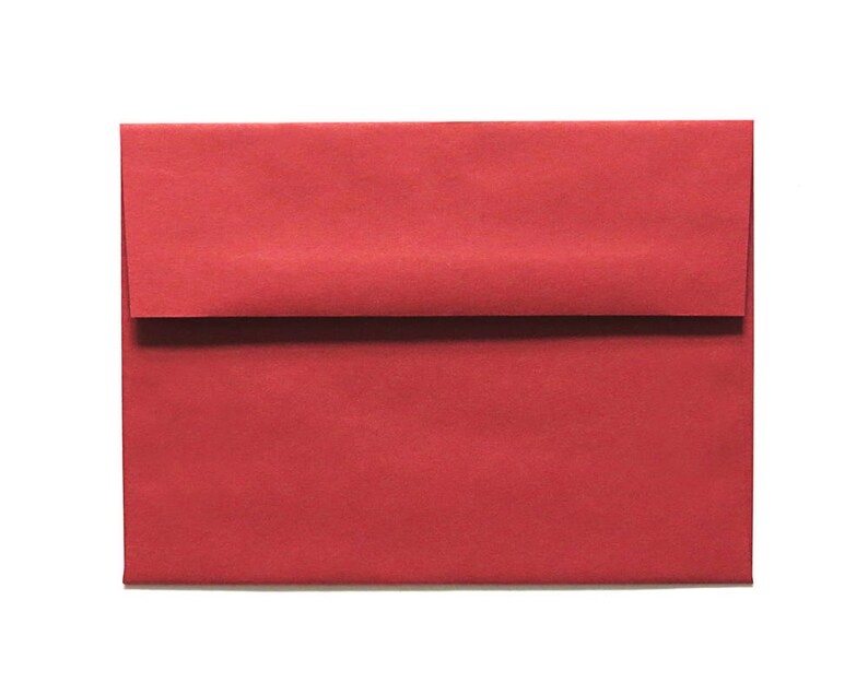 May include: A red envelope with a flap on the top. The envelope is made of a textured paper.