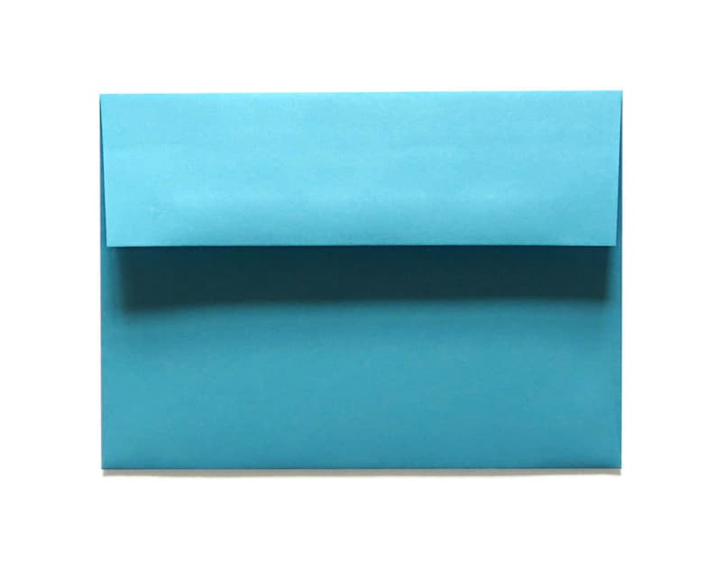 May include: A teal blue envelope with a rectangular shape and a folded flap. The envelope is made of paper and is set against a white background. The envelope is a solid color with no visible text or design.