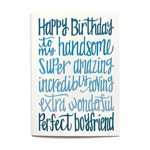 May include: A birthday card with blue and white lettering that reads "Happy Birthday to my handsome super amazing incredibly loving extra wonderful perfect boyfriend".