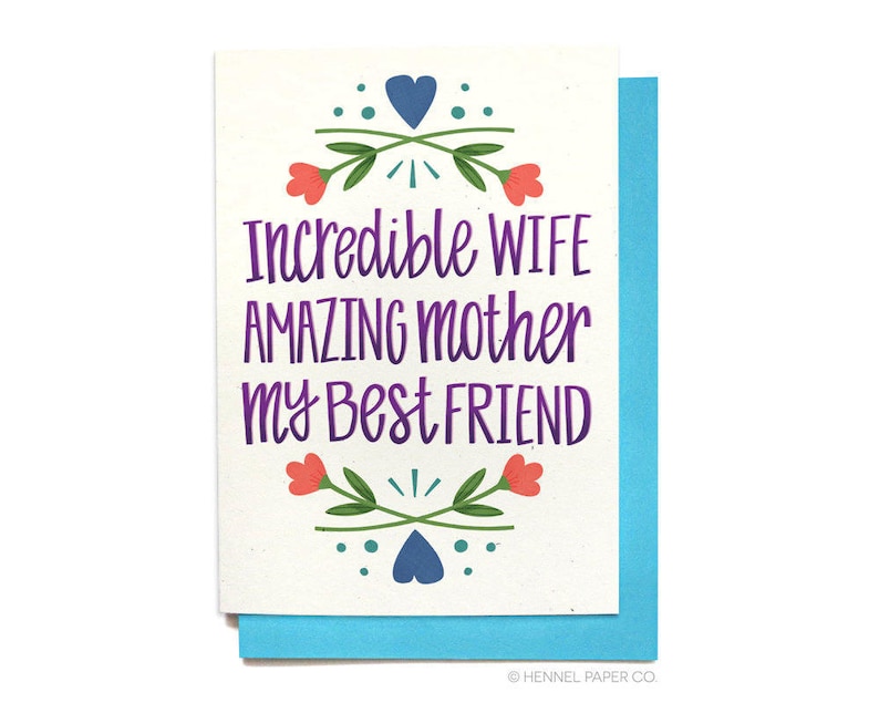 May include: Greeting card with a white background and a blue border. The card features the text "Incredible WIFE AMAZING mother my Best FRIEND" in purple, with floral and heart illustrations in red, green, and blue.