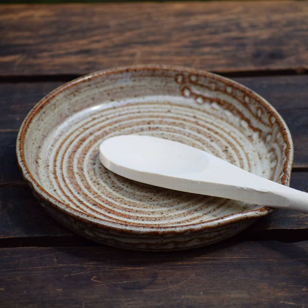 stoneware spoon rest with wooden spoon