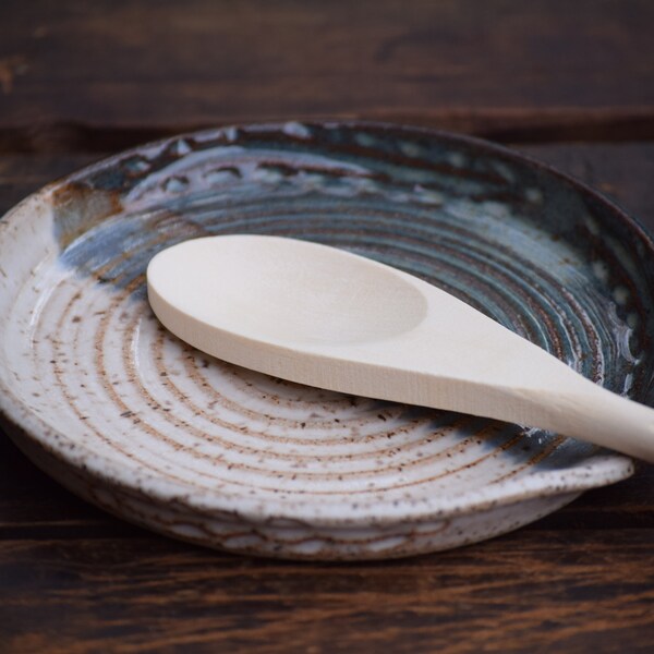 stoneware spoon rest with wooden spoon