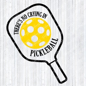 May include: Black and white silhouette of a pickleball paddle with a yellow pickleball inside. The paddle has the text "There's no crying in pickleball" written on it.