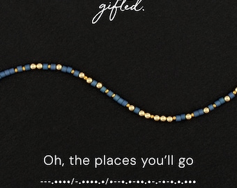 May include: A beaded bracelet featuring a repeating pattern of matte slate blue cylindrical beads and small metallic gold spherical beads. The text "gifted." appears at the top, with "Oh, the places you'll go" and Morse code below it.