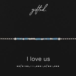 May include: A silver chain bracelet featuring a sequence of small metallic silver beads and blue cylindrical beads arranged in a Morse code pattern. The text gifted. appears above the bracelet, and the text I love us with Morse code dots and dashes appears below.