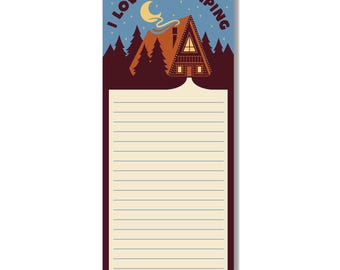 May include: A notepad with the text "I love not camping" above a cabin illustration. The notepad has a lined section for notes and the words "Poppy & Quail" at the bottom. The background is blue with a crescent moon and stars.