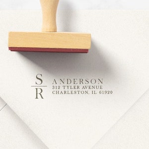 May include: A white envelope with a custom return address stamp. The stamp reads "S/R Sanderson 312 Tyler Avenue Charleston, IL 61920".