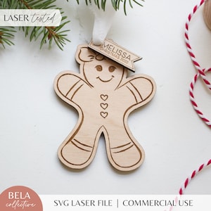 May include: A laser-cut wooden gingerbread person ornament with a banner that reads "Melissa Christmas 2023".