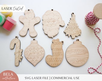 May include: Set of seven unfinished wooden Christmas ornaments. The ornaments include a gingerbread person, Santa Claus, a Christmas tree, a candy cane, a stocking with a bear inside, and two ornaments with geometric designs. The ornaments are ready to be painted.