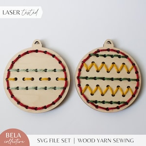May include: Two wooden Christmas ornament shapes with pre-punched holes for yarn sewing. One ornament has a red, green, and yellow striped pattern. The other ornament has a zig-zag pattern with red, green, and yellow yarn.