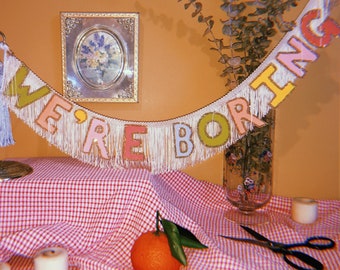 Funny 'We're Boring' Fringe Banner: Humorous Novelty Decor