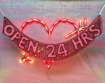Open 24 Hrs Glitter Fringe Banner: Neon Sign Inspired Decor