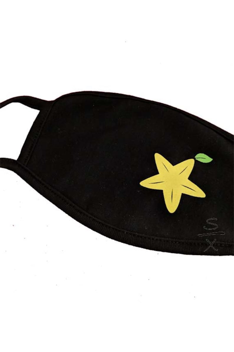 May include: Black face mask with a yellow starfruit design. The starfruit has a green leaf.
