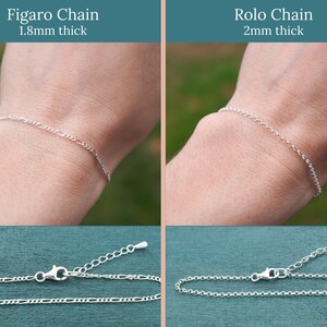 May include: Two silver chain bracelets are displayed. The top half shows the bracelets worn on a wrist, with text indicating the Figaro chain is 1.8mm thick and the Rolo chain is 2mm thick. The bottom half shows the bracelets laid flat.