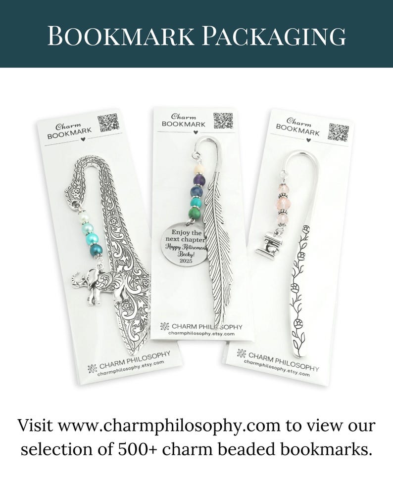 three charm bookmarks packaged in white paper, each featuring a unique design and color scheme.