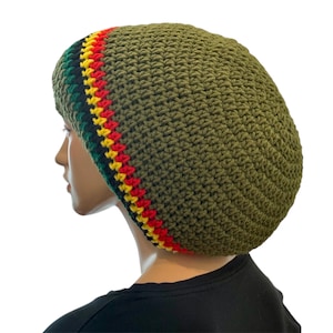 May include: Olive green crochet beanie with a striped trim in the colors of red, yellow, and green. The hat is shown on a mannequin head. The hat is a comfortable, stylish accessory.