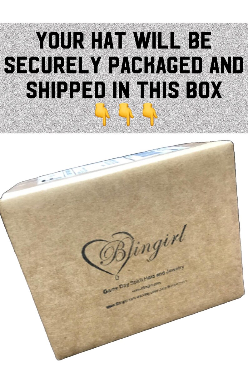 May include: A brown cardboard box with the text "YOUR HAT WILL BE SECURELY PACKAGED AND SHIPPED IN THIS BOX" on the top. The box has a logo on the side that says "Blingirl Game Day Spirit Hats and Jewelry" with a heart shape around the word "Blingirl".