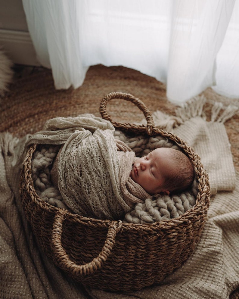 Heirloom Vintage Mohair Wrap with pretty botanical pattern wrapped around newborn baby, asleep in basket. Newborn Photography Prop session.
