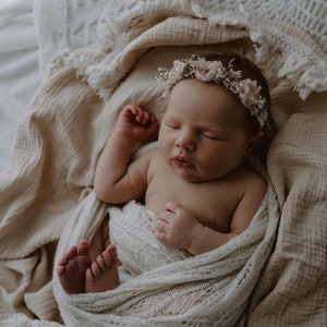 Heirloom Vintage Mohair Wrap with pretty botanical pattern wrapped around newborn baby, asleep in basket. Newborn Photography Prop session.