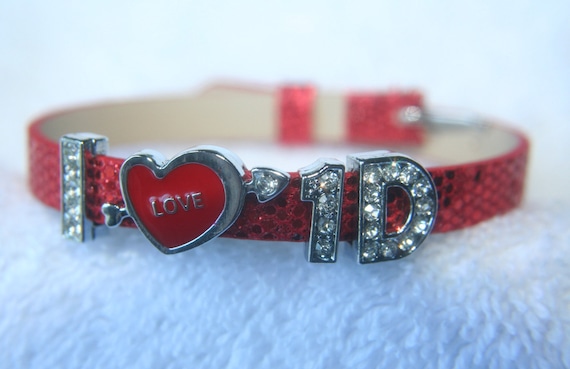 Items similar to One Direction Slider Wristbands - 