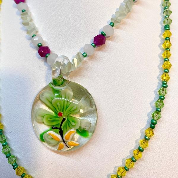 A Tiny Butterfly Alights a Burst of Green in a Delightful Murano Art Glass Pendant A Two Strand Necklace of Pink Tourmaline, Opal & Crystals