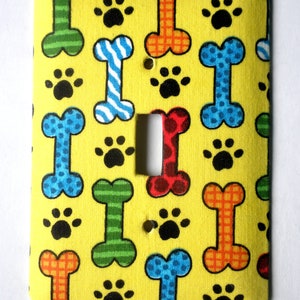 Dog Bones and Paw Prints on Yellow Background Single Light Switch Plate Switchplate image 1