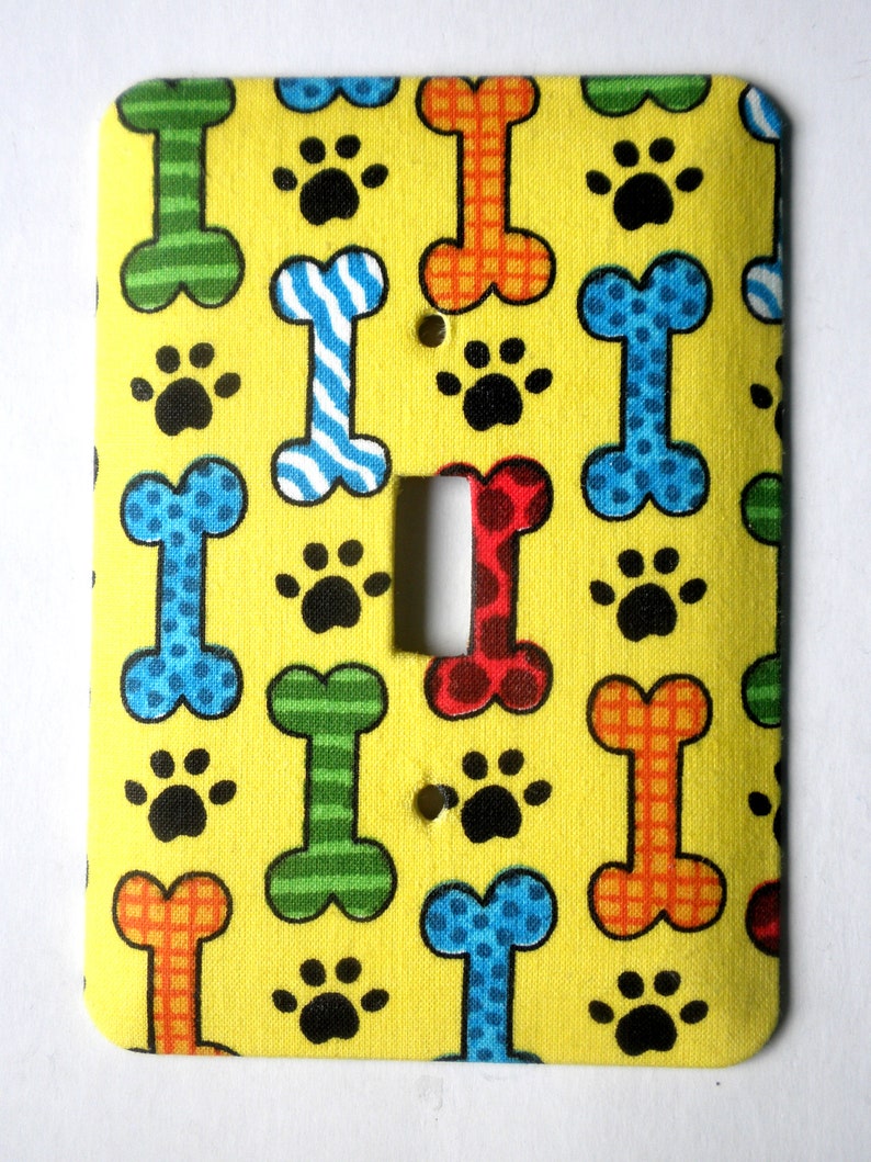 Dog Bones and Paw Prints on Yellow Background Single Light Switch Plate Switchplate image 1