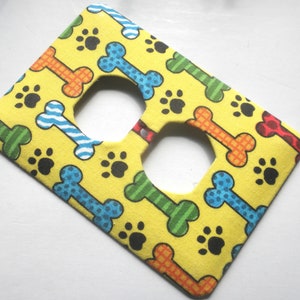 Dog Bones and Paw Prints on Yellow Background Outlet Cover image 2