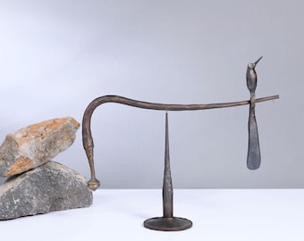 forged iron humming bird balance a delicate art metallwork