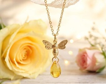Gouden bijenketting en oorbellen: gele glazen druppelhanger