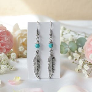 May include: A set of three ceramic mugs with a speckled, matte finish. The mugs are in shades of cream, light gray, and dark gray. Each mug has a simple, minimalist design, perfect for coffee or tea.