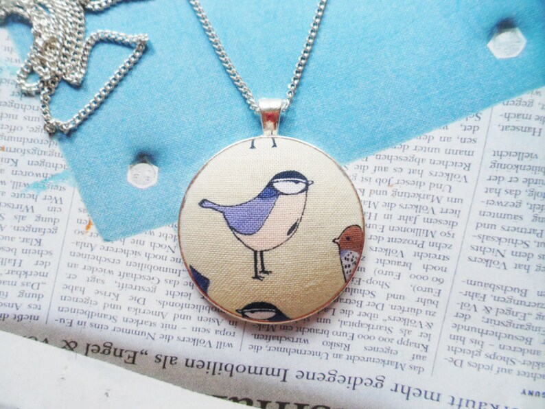 Scandinavian bird necklace with a cotton fabric pendant and silver plated chain Selma Dreams
