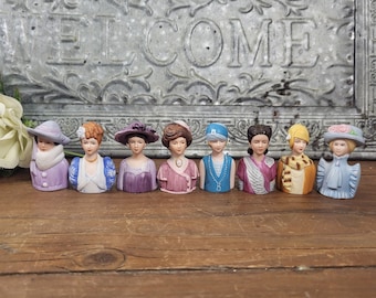 Complete 8-Piece set of ‘Ladies Fashion Through the Years’ Porcelain Thimbles - Vintage Avon 1982-1984