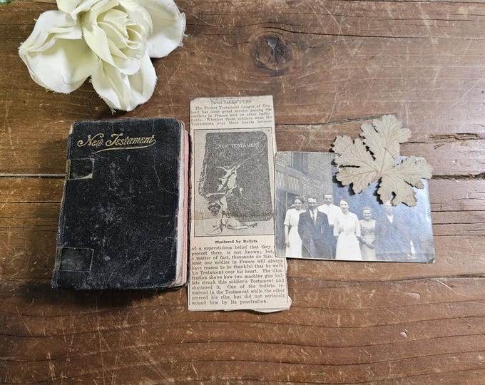 WWI Soldier’s Pocket-sized New Testament with Picture of Family, Newspaper clipping, and Pressed Leaf