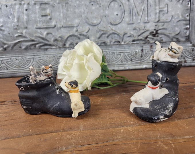 Two Vintage Souvenir Porcelain Black Shoe Ashtrays Featuring a Dog and Cat