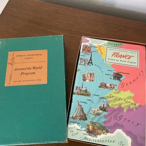 May include: A set of three ceramic mugs with a speckled, matte finish. Each mug features a different color: light blue, cream, and gray. The mugs have a simple, modern design and a comfortable handle.