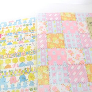 May include: Two sheets of pastel-colored gift wrap with a patchwork design featuring baby animals, flowers, and umbrellas. The text on the label reads "Flourish Gift Wrap 694 2 Sheets 25 in. x 20 in. (63.5 cm x 50.8 cm) For Larger Gifts."