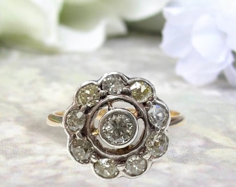Early 1900s Edwardian Diamond Flower Ring in 18 karat yellow gold and platinum stamped "T&S"