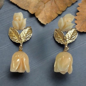 1950s Vintage Carved Angel Skin Coral Earrings with Gold Leaves in 14 karat yellow gold
